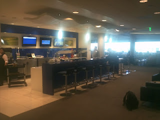 a room with a counter and chairs