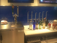 a bar with a row of bottles