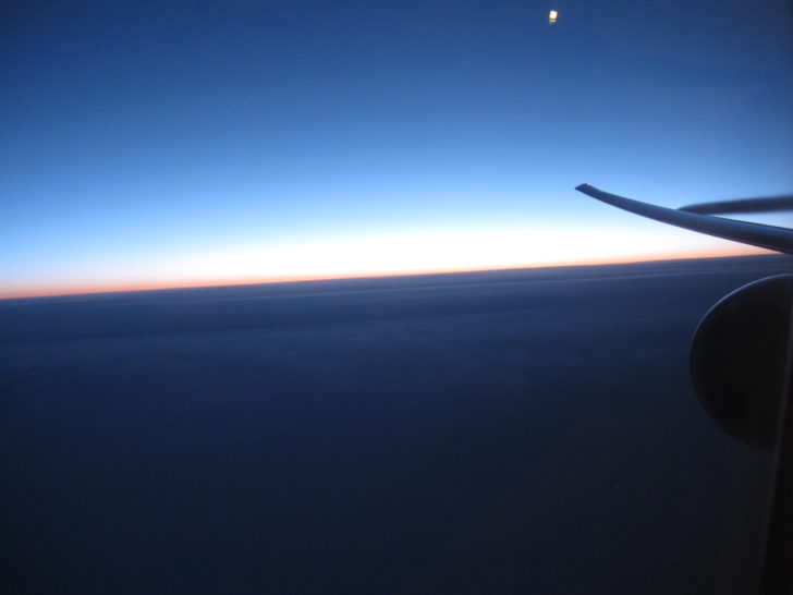 an airplane wing in the sky