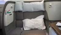 a seat with pillows on the back