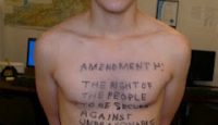 a man with writing on his shirt