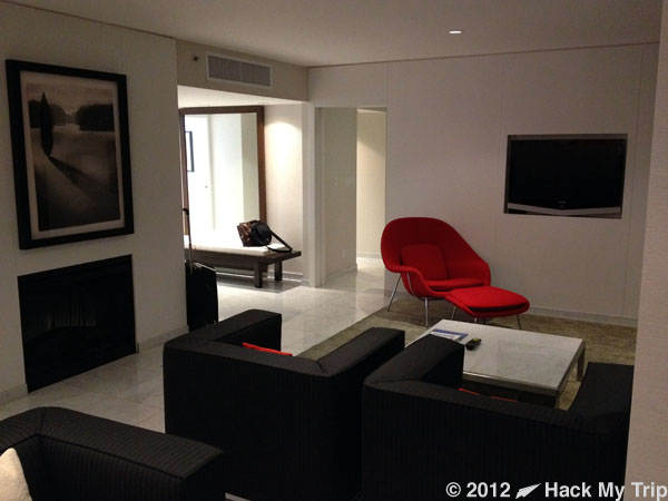 picture of hotel room TV and chairs