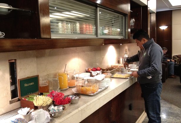 a man standing at a buffet