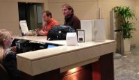 a group of men at a reception desk