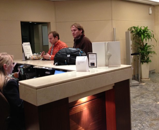 a group of men at a reception desk