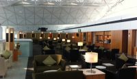 a lounge area with chairs and tables