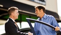 a man shaking hands with another man
