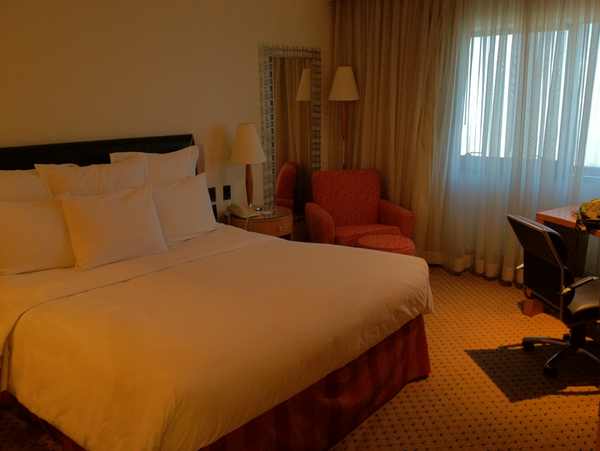 a room with a bed and a desk