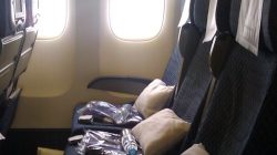 a row of seats with windows in the back