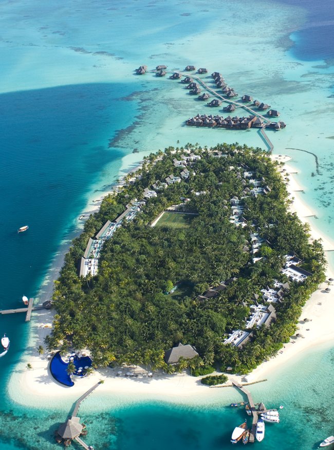 an island with a group of houses and a beach
