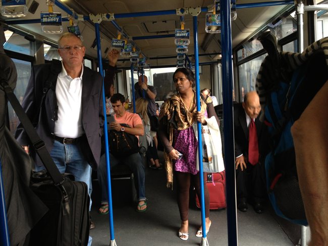 people on a bus with people on the floor