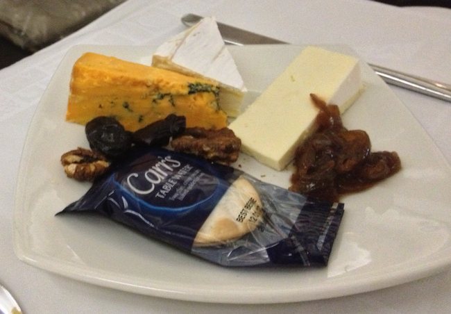 a plate of cheese and nuts