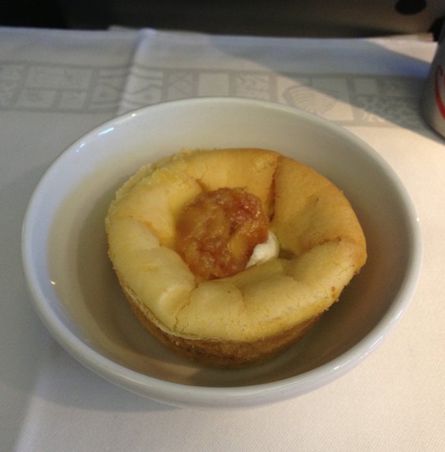 a small white bowl with food in it