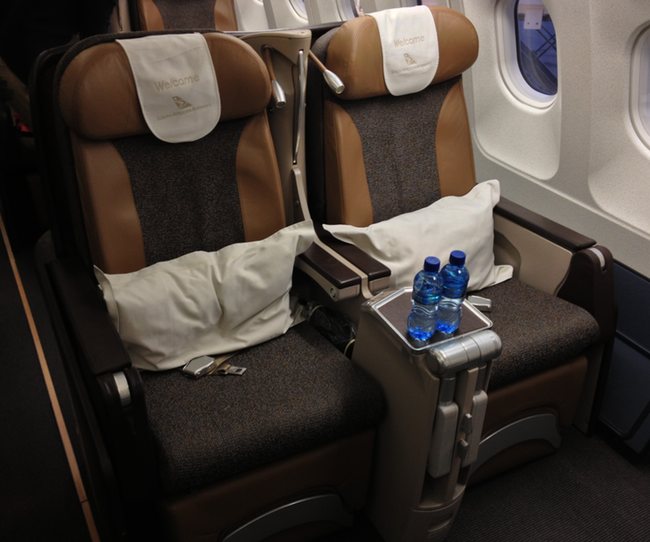 a seat with two pillows and a pillow on the side of the seat