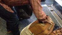 a man looking over his luggage