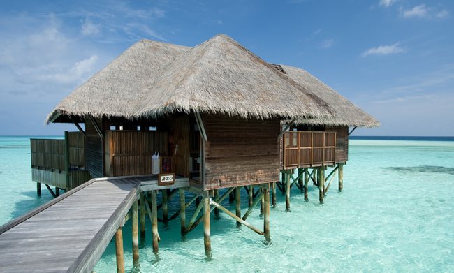 a building on stilts in the water