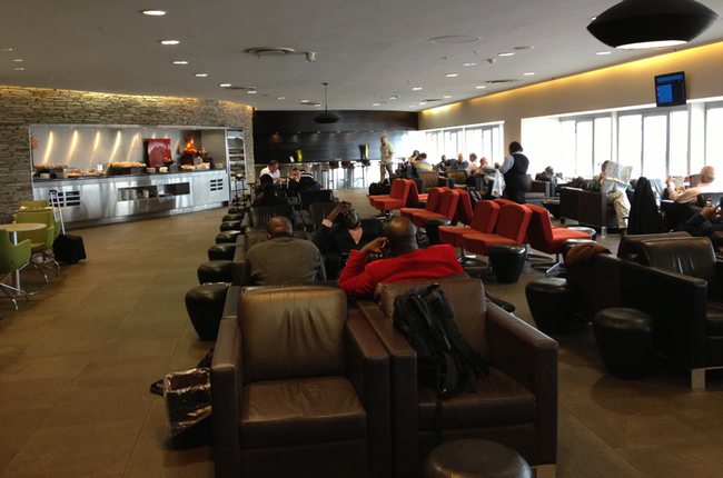 a group of people sitting in a lounge area