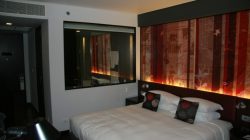 a bed with pillows in a room
