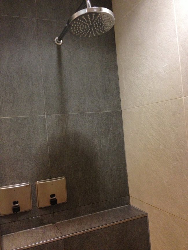 a shower head in a bathroom