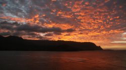 a sunset over a body of water