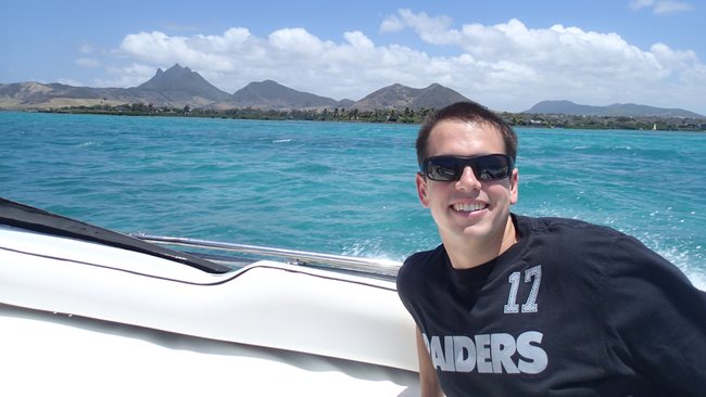 a man in sunglasses on a boat