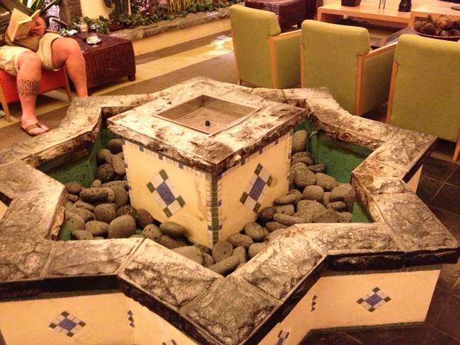a fountain with rocks around it