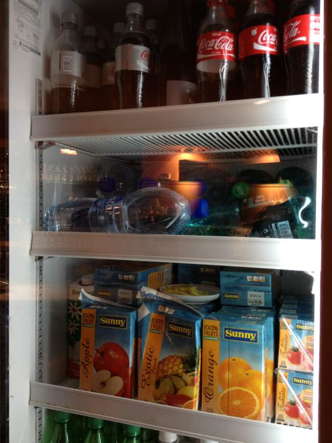 a refrigerator with drinks and juices