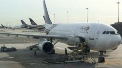 a large white airplane at an airport