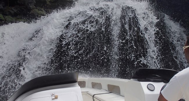 a boat with water splashing over it