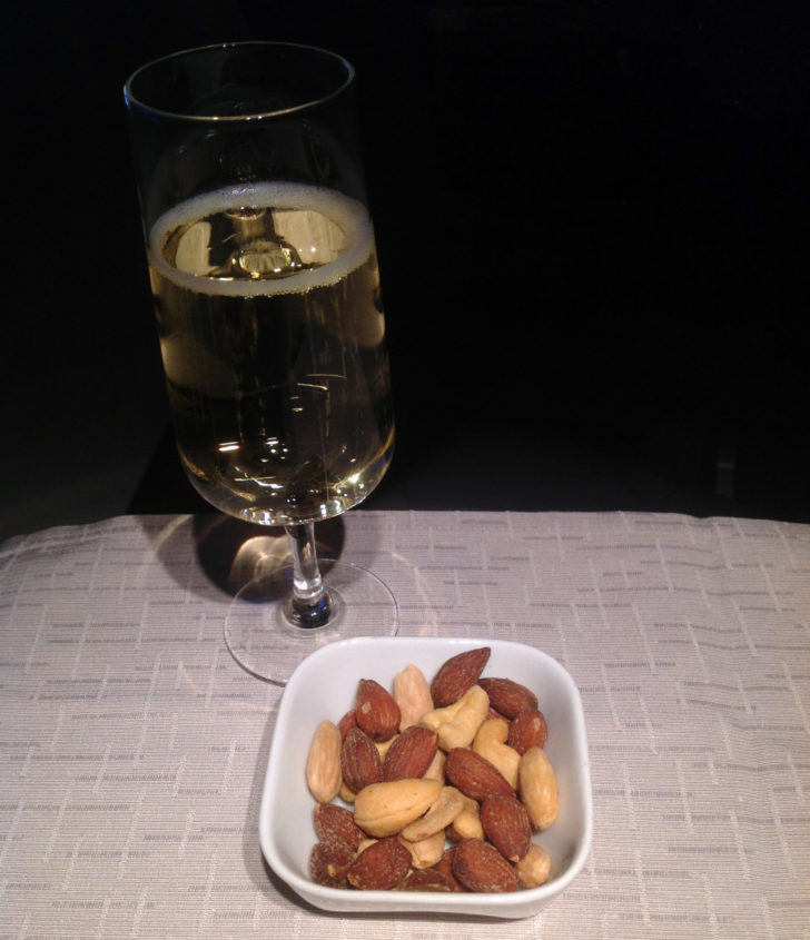 picture of nuts and sparkling wine