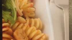 a plate of pasta and a fork