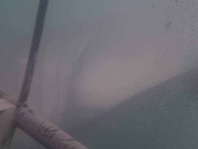 a metal pipe in water