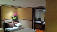 a room with a bed and a bathtub