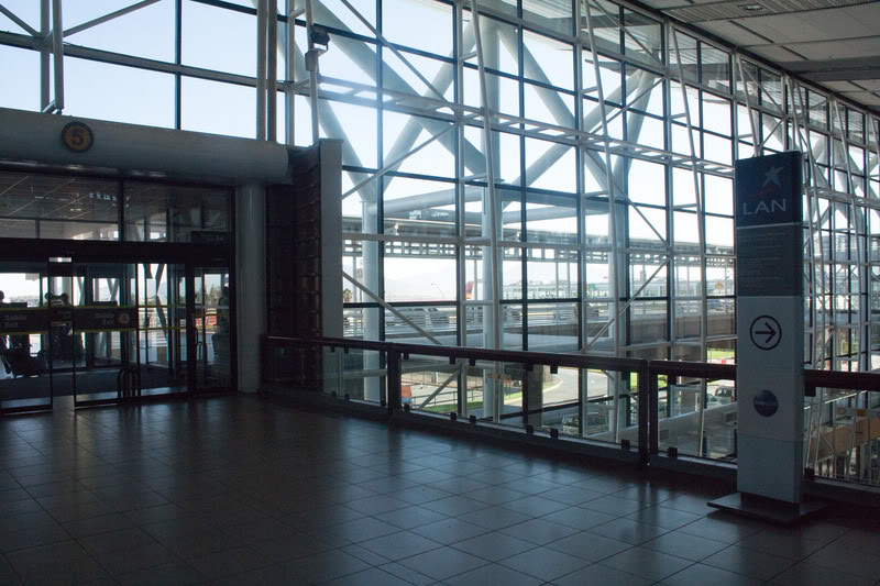 a large glass wall with a railing