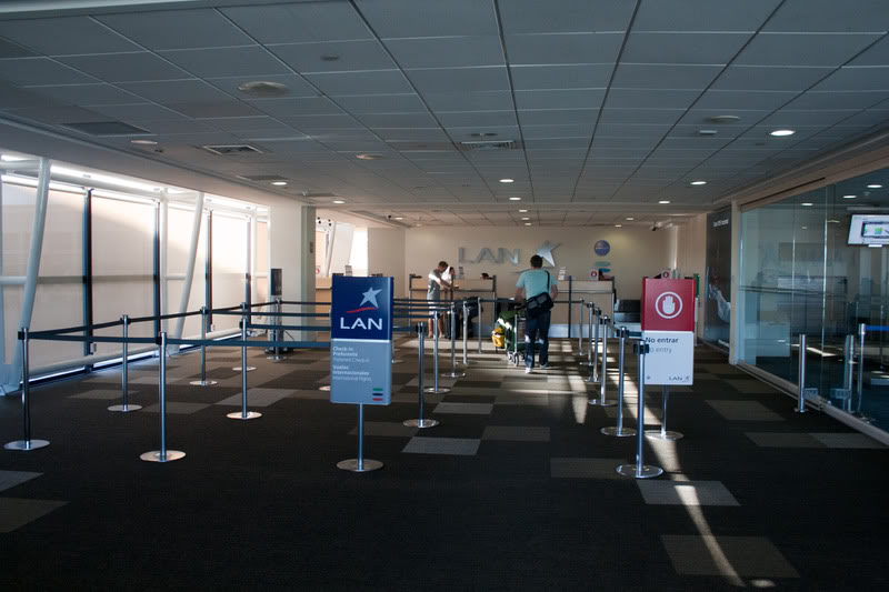 people standing in a line in an airport