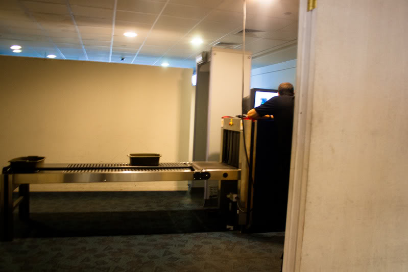 a man standing at a metal detector