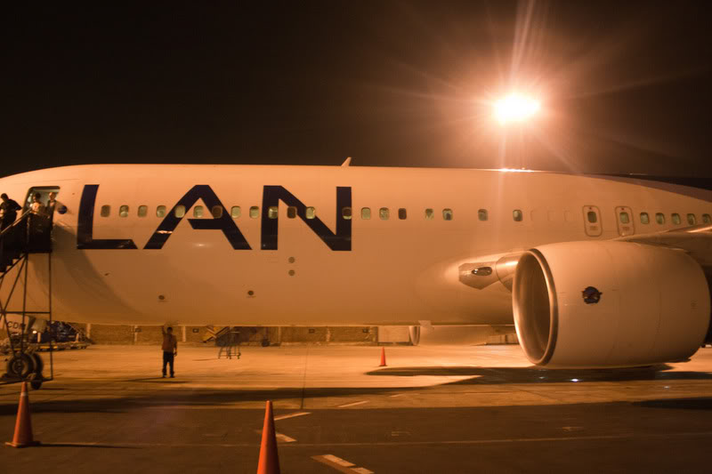 a large white airplane with black text on it