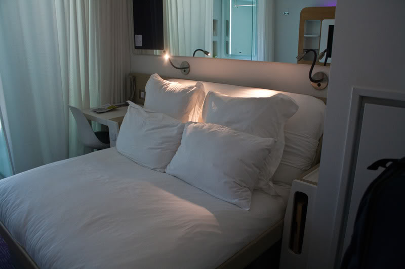 a bed with white pillows