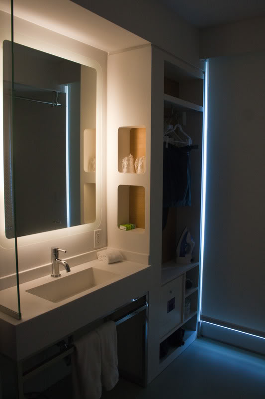 a bathroom with a mirror and a sink