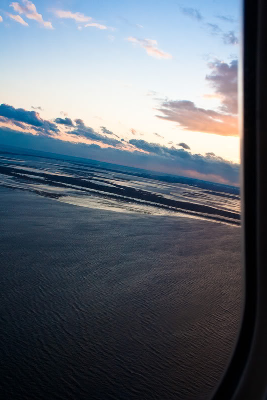 a view of the ocean from an airplane window
