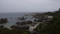 a beach with rocks and water