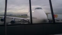 a large white airplane in an airport