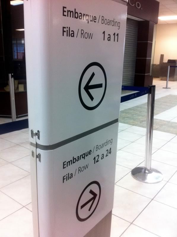 a white refrigerator with black arrows and a black arrow on it