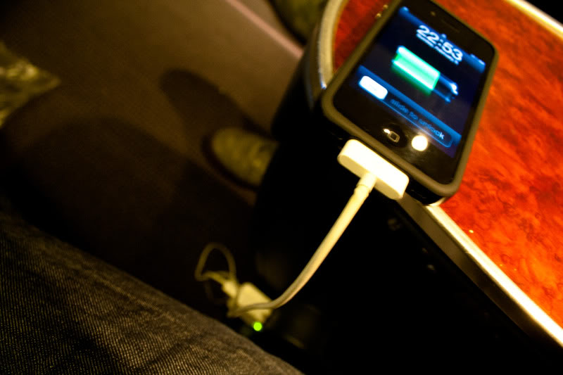 a cell phone charging on a charger