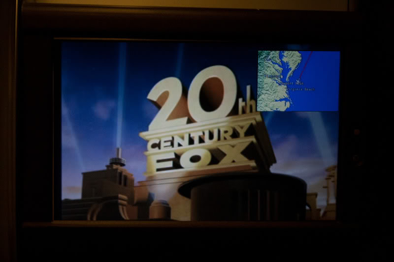 a television screen with a sign and map