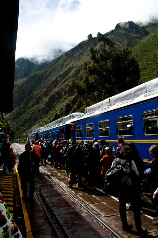 a group of people boarding a train