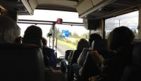 a group of people sitting on a bus
