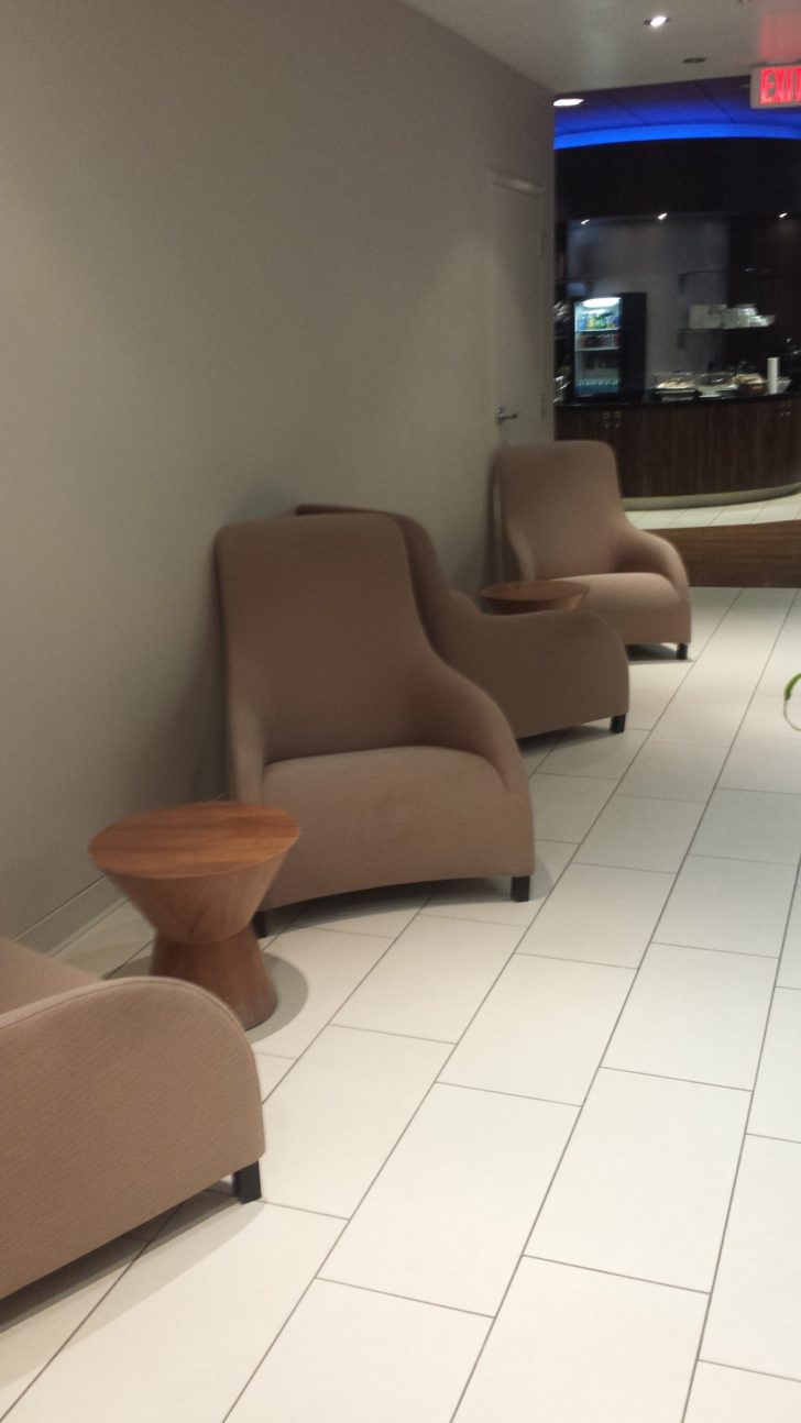 a group of chairs and a table in a room