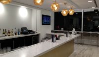 a room with a counter and a television