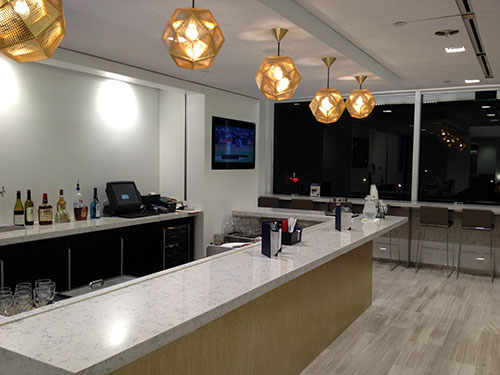 a room with a counter and a television
